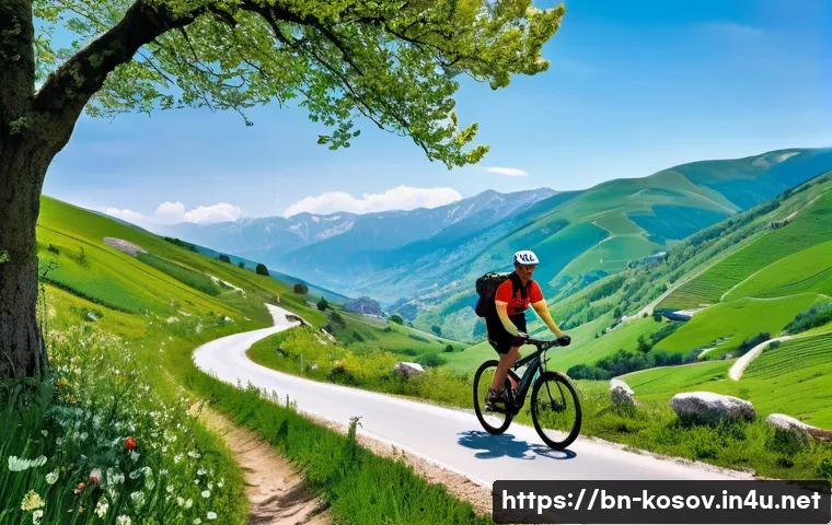 코소보에서 자전거 타기 좋은 곳 - A scenic mountain cycling trail in Kosovo during spring, featuring lush green hills and colorful wil...
